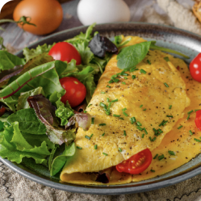 Omelet made with free range eggs with tomatoes and salad